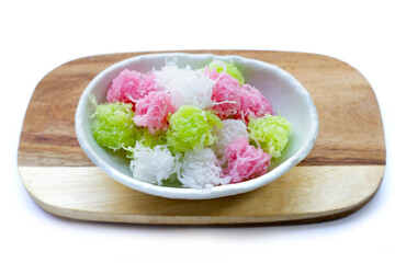 Sweet coconut balls, crispy coconut candies (Maprao Gaew). Thai traditional dessert