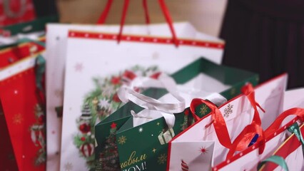 New Year corporate gifts and Xmas souvenirs for company employees, Christmas party surprise gift bag, gift giving at office work, red green white paper bags, presents exchange with colleagues at work - Powered by Adobe