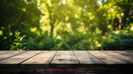 Empty old wooden table with green nature background