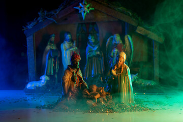 Traditional Christmas scene birth of Jesus. Christmas Manger scene with figures of Jesus, Mary,...