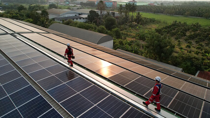 solar roof installation, Engineer with safety PPE and Harness install solar cell on the roof of...