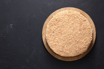 Delicious Napoleon cake on black table, top view. Space for text