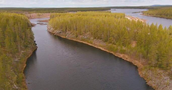 Aerial landscape view of Kitinen river in cloudy spring weather, Sodankylä, Finland.
