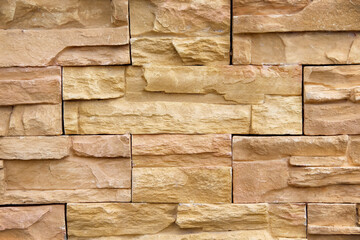 Brown sandstone texture in seamless patterns wall background