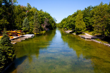 Serene Summer River Landscape with Kayaks in Empire, Michigan