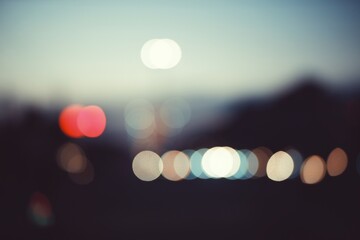 Colorful defocused bokeh abstract background created by city night lights. Blurred defocused...