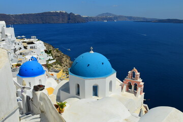 SANTORINI,GREECE-June 20 2023: Oia village, the most picturesque village on Santorini island, a famous touristic resort in the Cyclades islands, Aegean sea, Greece, Europe. This was on a hot sunny day