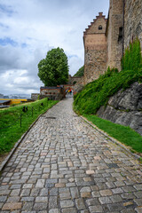 Fototapeta na wymiar Historic Akershus Castle in the city center of Oslo, Norway, stone walkway around the outside of the fortress wall 