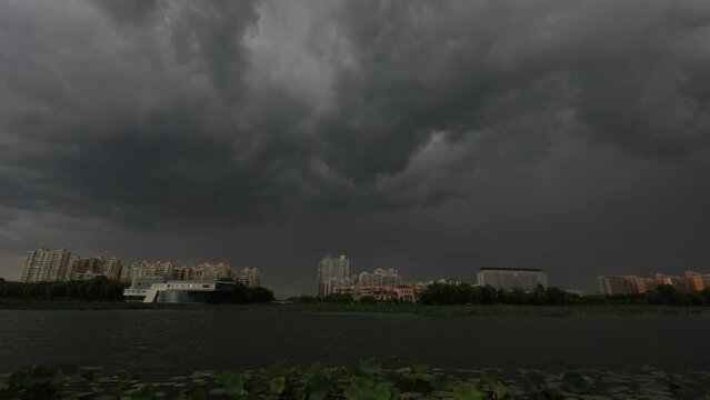 Dark clouds rolling over the river, North China