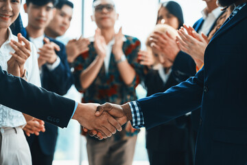 Cropped image of businessmen shaking hand and making a contract in the sign of agreement,...