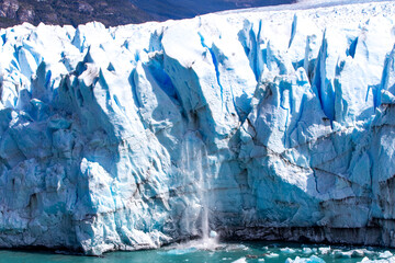 Ice calving from the terminus of the Perito Moreno Glacier in Los Glaciares National Park, Santa...