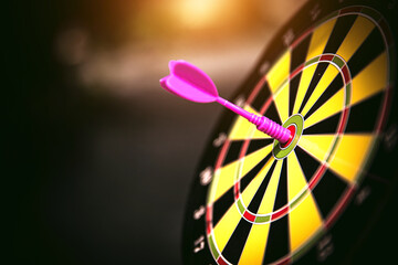 Bullseye target goal or dartboard has dart arrow throw hitting center shooting for financial...