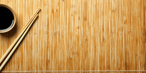 chopsticks on bamboo mat