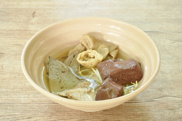 boiled pork blood and entrails with bean sprout in clear soup on bowl 