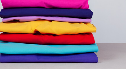 stack of colorful clothes