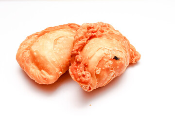 Fried flour snack or curry puff filled with chicken, a popular snack in Thailand. placed on a white background