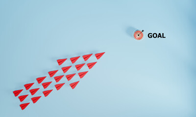 Red airplane flying towards target. The concept of leadership, achieving the goal. Success. risk...
