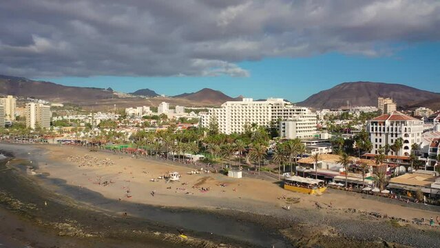 Aerial 4K video from drone to de Tenerife and beachs Adeje Playa de las Americas, Playa Honda,Playa de Troya, Playa de El Bobo.In the background Tenerife at sunset. Tenerife, Canary islands, Spain 