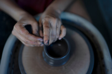 Close up of pottery making process.