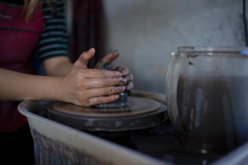 Close up of pottery making process.