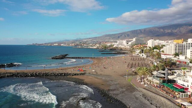 Aerial 4K video from drone to de Tenerife and beachs Adeje Playa de las Americas, Playa Honda,Playa de Troya, Playa de El Bobo.In the background Tenerife at sunset. Tenerife, Canary islands, Spain 