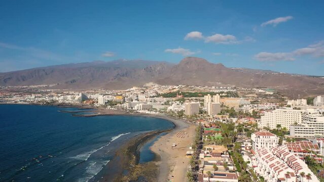 Aerial 4K video from drone to de Tenerife and beachs Adeje Playa de las Americas, Playa Honda,Playa de Troya, Playa de El Bobo.In the background Tenerife at sunset. Tenerife, Canary islands, Spain 