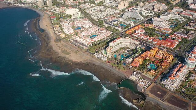 Aerial 4K video from drone to de Tenerife and beachs Adeje Playa de las Americas, Playa Honda,Playa de Troya, Playa de El Bobo.In the background Tenerife at sunset. Tenerife, Canary islands, Spain 