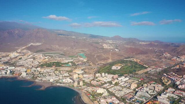 Aerial 4K video from drone to de Tenerife and beachs Adeje Playa de las Americas, Playa Honda,Playa de Troya, Playa de El Bobo.In the background Tenerife at sunset. Tenerife, Canary islands, Spain 