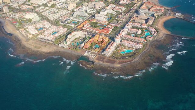Aerial 4K video from drone to de Tenerife and beachs Adeje Playa de las Americas, Playa Honda,Playa de Troya, Playa de El Bobo.In the background Tenerife at sunset. Tenerife, Canary islands, Spain 