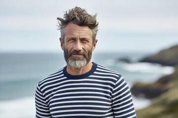 Portrait of a mature French man wearing a striped sailor sweater