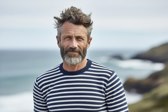 Portrait of a mature French man wearing a striped sailor sweater