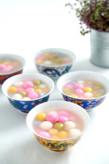 Tangyuan, Glutinous Sweet Balls, Served in Ginger Syrup. a traditional cuisine for Mid-autumn, Dongzhi (winter solstice) and Chinese new year. Selective focus.
