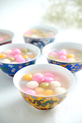 Tangyuan, Glutinous Sweet Balls, Served in Ginger Syrup. a traditional cuisine for Mid-autumn, Dongzhi (winter solstice) and Chinese new year. Selective focus.
