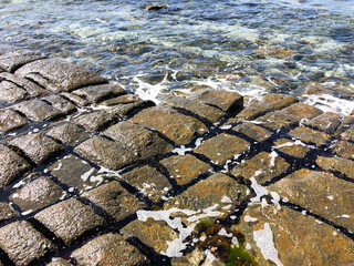 Rectangular stone in the ocean