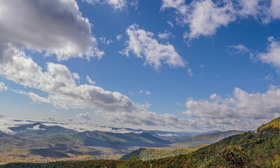 mountains landscape with moving clouds & fall color