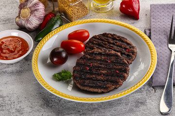 Grilled burger cutlet with sauce