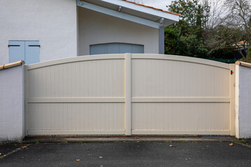 Fototapeta na wymiar portal sliding closed beige round metal aluminum slide gate of modern door house