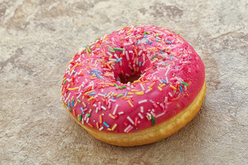 Sweet glazed struwberry donut with icing