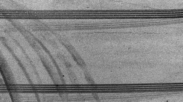 Aerial top view car tire marks burnout, Tire marks on the asphalt road, Tire mark on race track texture and background.