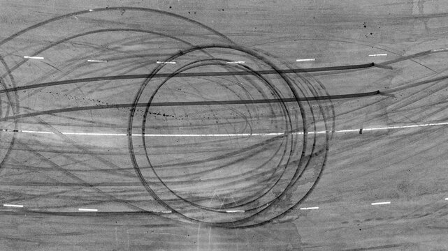 Aerial top view car tire marks burnout, Tire marks on the asphalt road, Tire mark on race track texture and background.