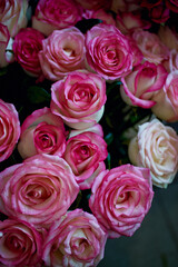 Close-up of pink roses with green leaves in a bouquet