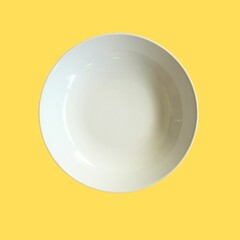 Empty ceramic round white plate on top view isolated on  background