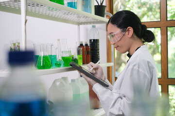 Green Plant Laboratory, scientist research with bottles on a shelf, check information, medical and science. Healthcare medicine and with innovation in manufacturing of vaccine, chemical and inventory.