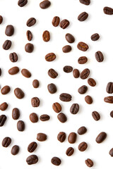 Top view Roasted coffee beans scattered isolated on a white background.