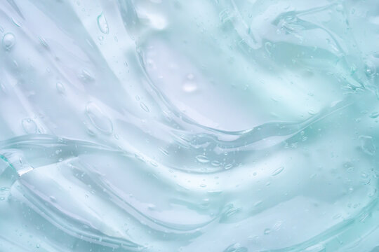 Transparent clear blue liquid serum gel cosmetic texture background