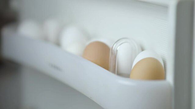 Fridge with chicken eggs in eggshell box