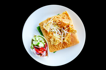 Top view of Thai Crispy Pancake (Kanom Buang)Vietnamese stuffed crispy omelette. with sliced cucumber,chillies sweet-sour vinegar, focus selective