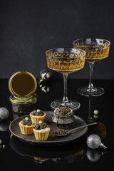 black caviar and champagne on black