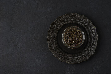 black caviar on a black background