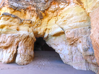 View of a cave through a opening in a Algarve cave in Portimao Portugal at praia da rocha